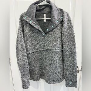 Latched mama baby wearing sweater M